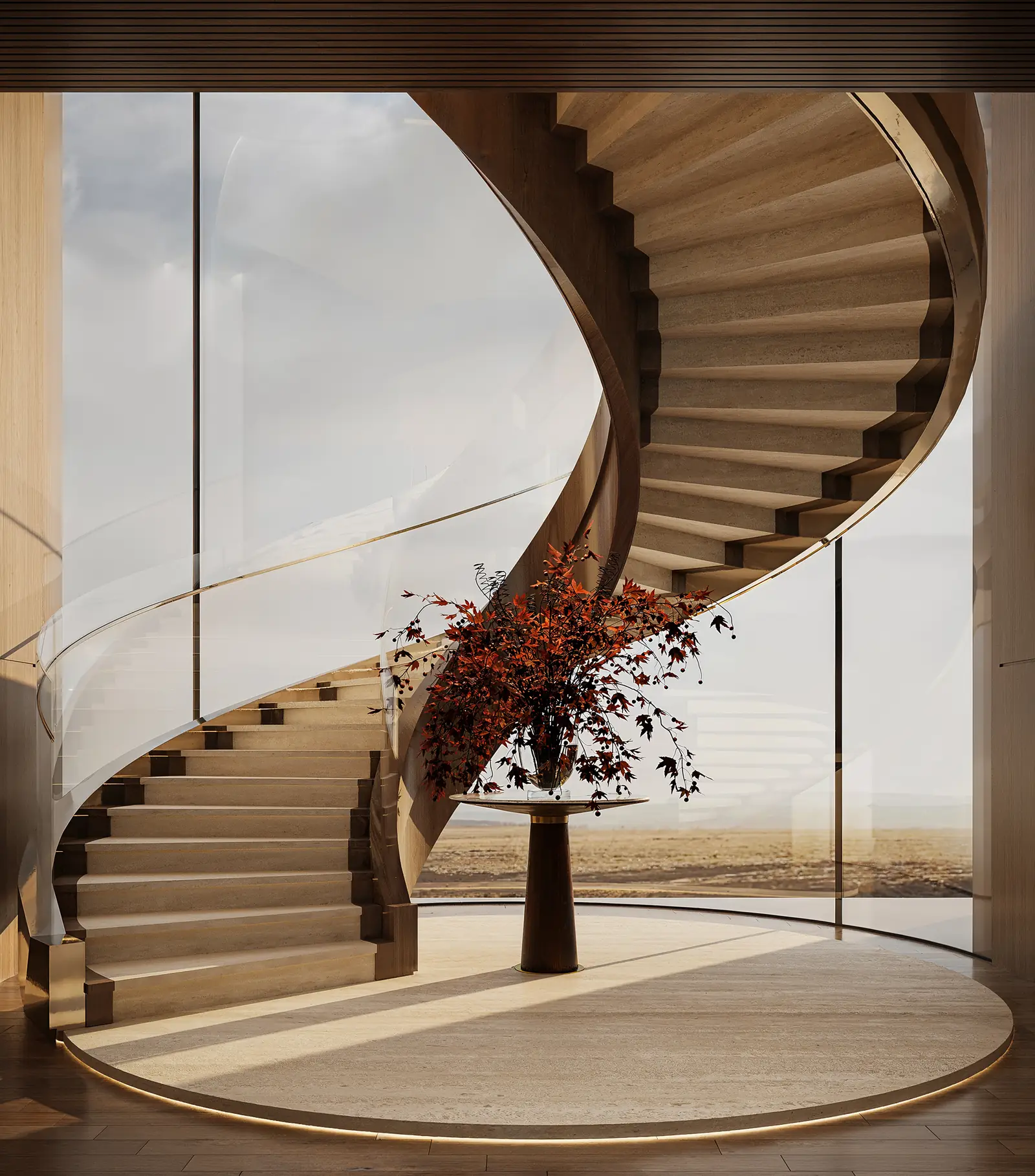 Curved staircase with glass balustrade and coastal view